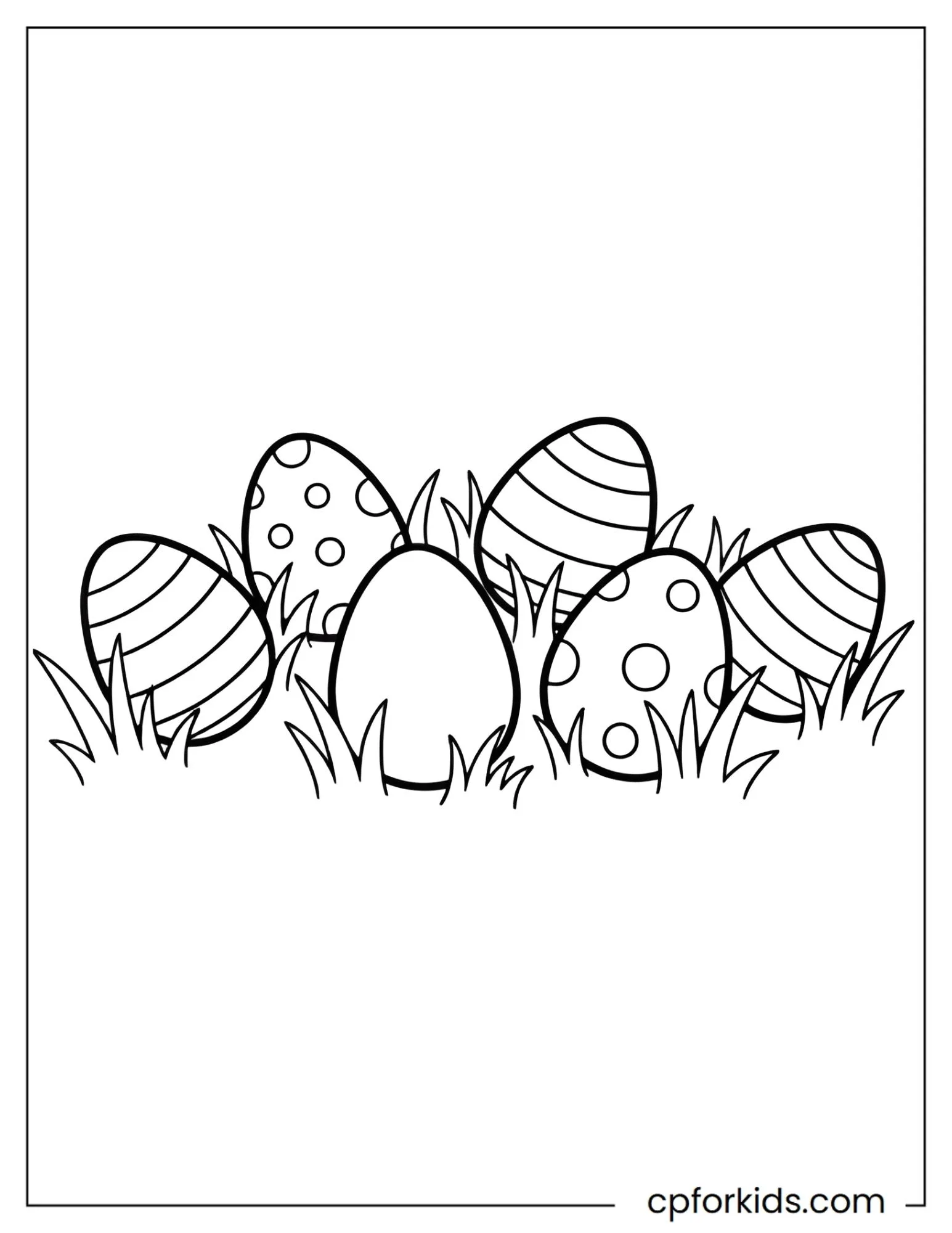 Decorated Easter eggs resting in short grass
